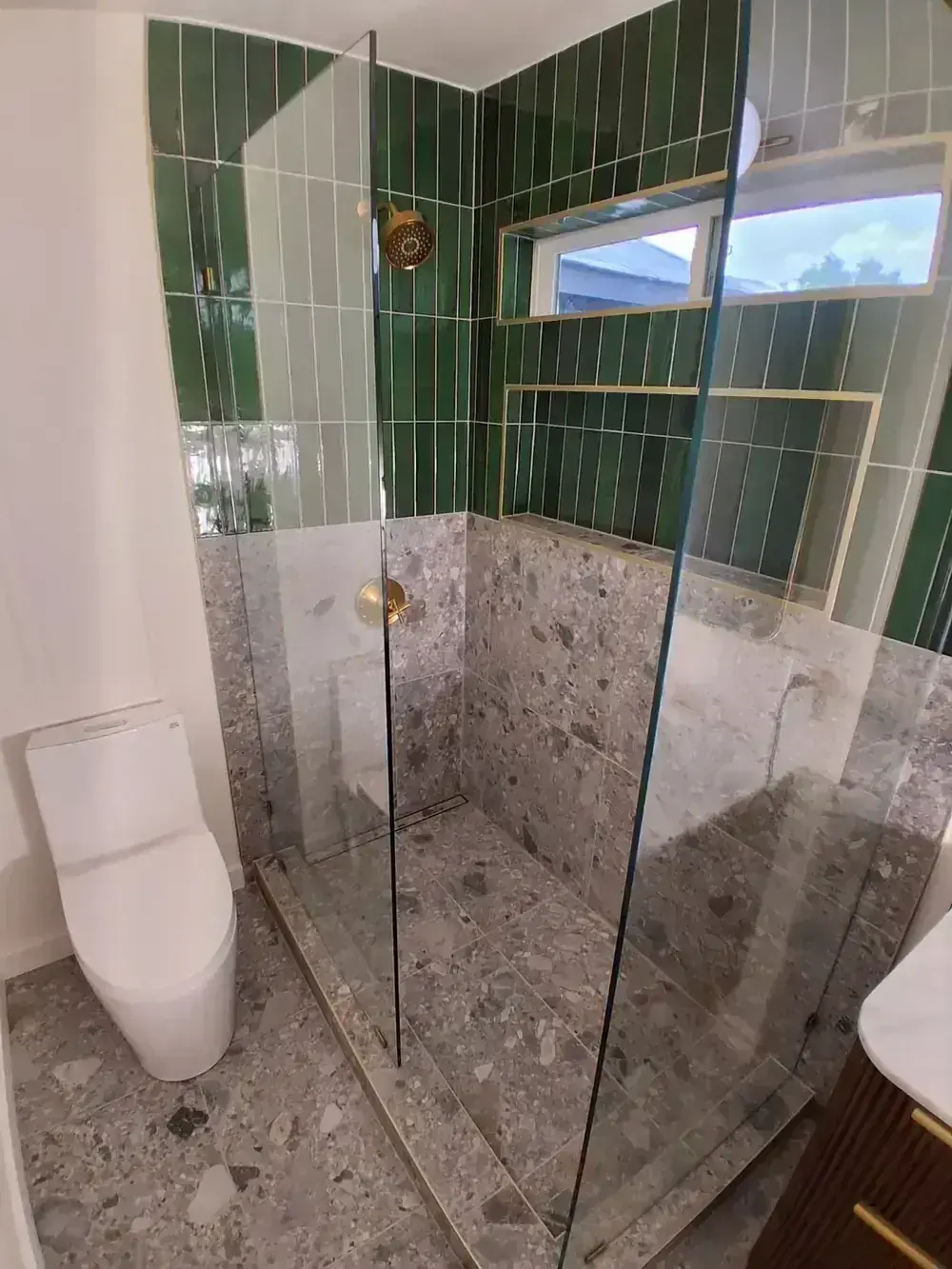 Green tile and terrazzo shower by BNB Concepts