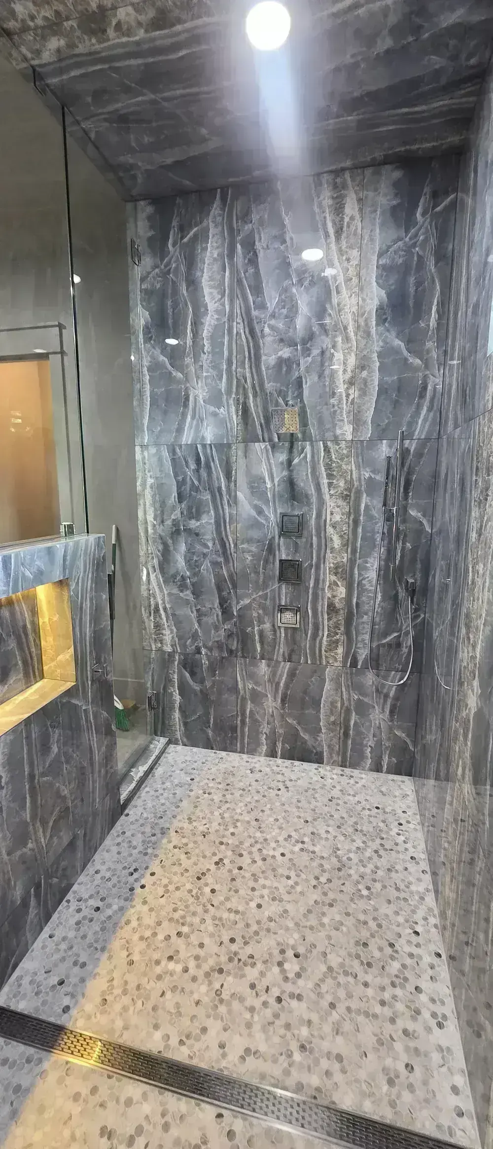 Marble Shower and Pebble Floor by BNB Concepts