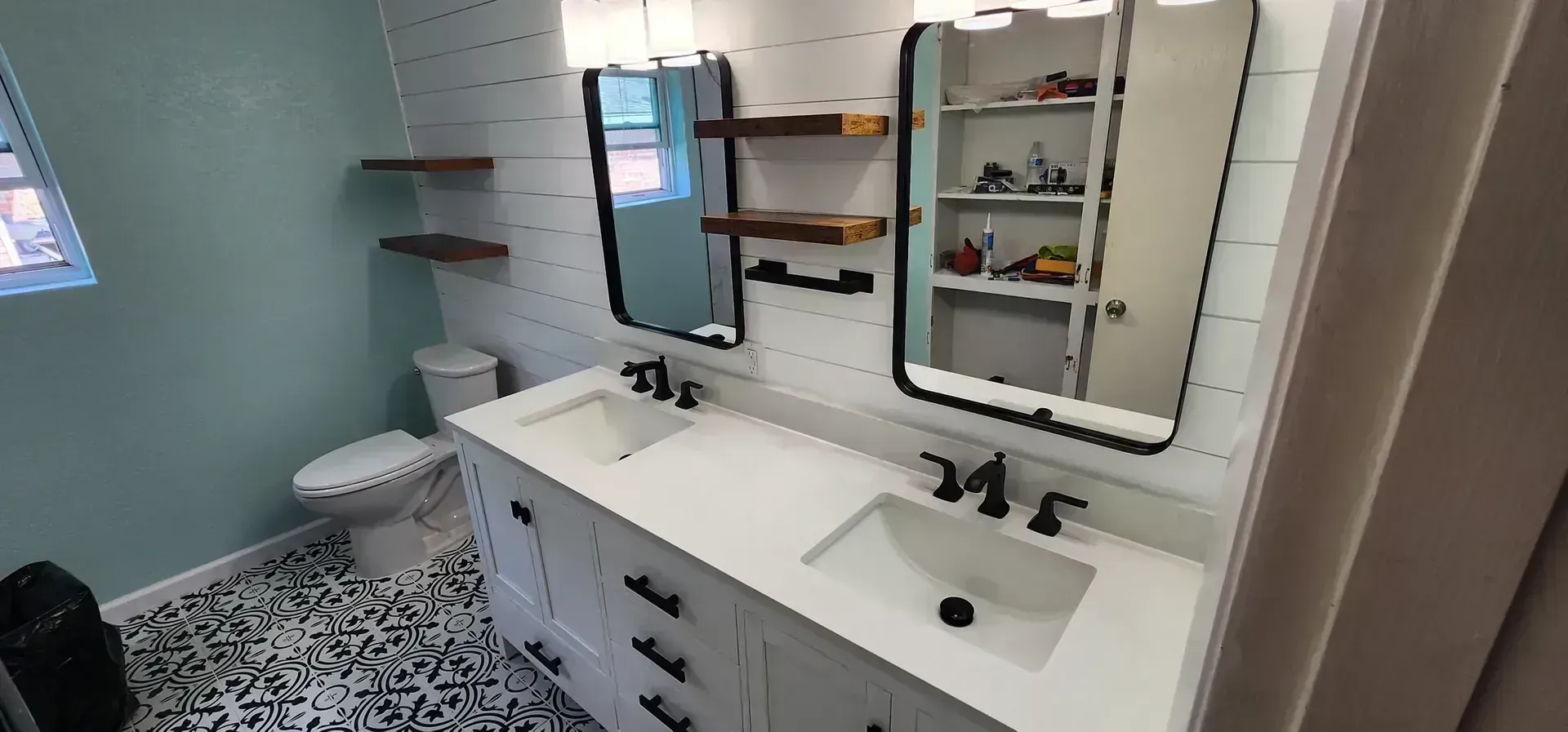 Shiplap bathroom with patterned tile floor by BNB Concepts