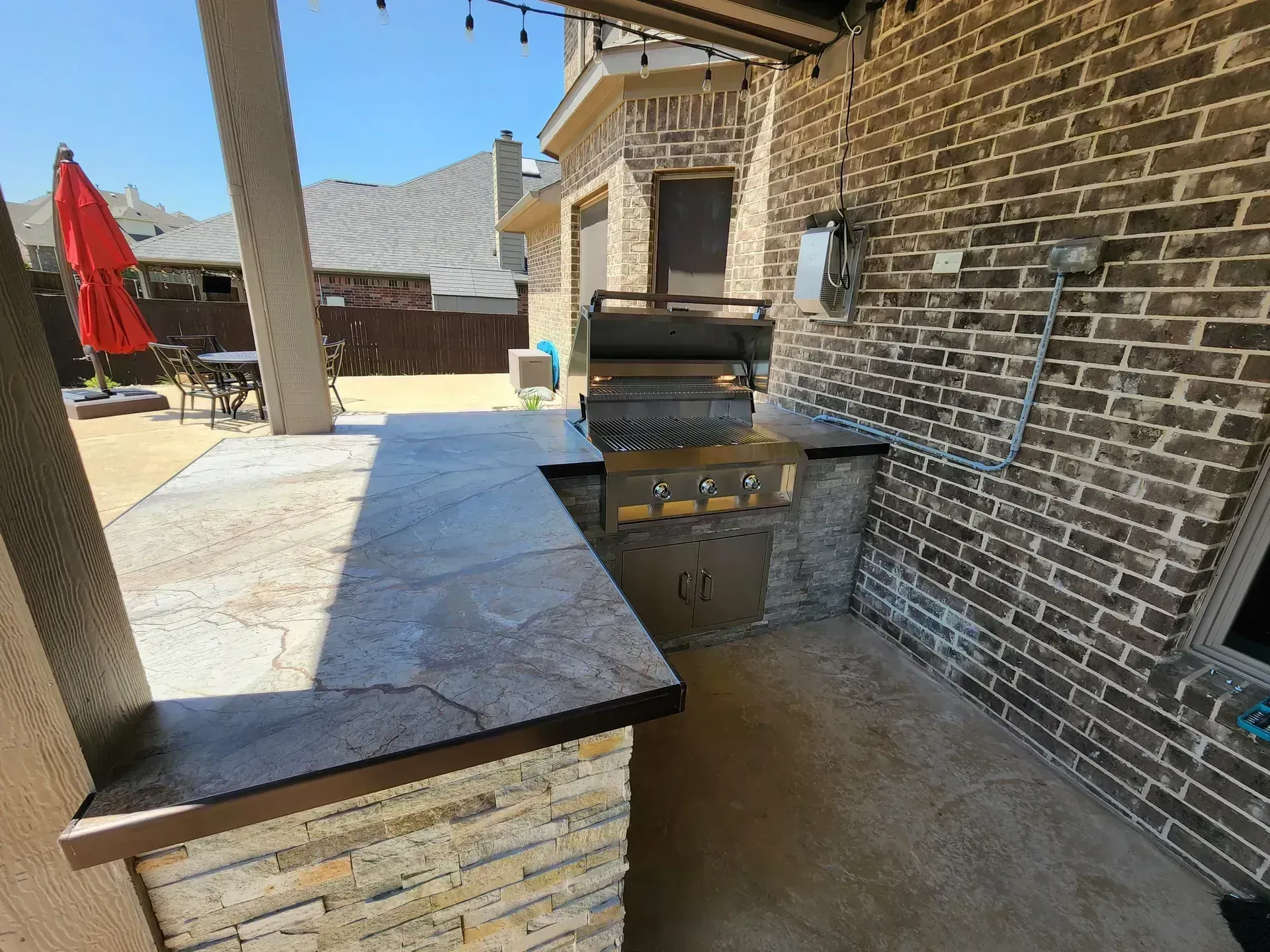 Covered outdoor kitchen built by BNB Concepts