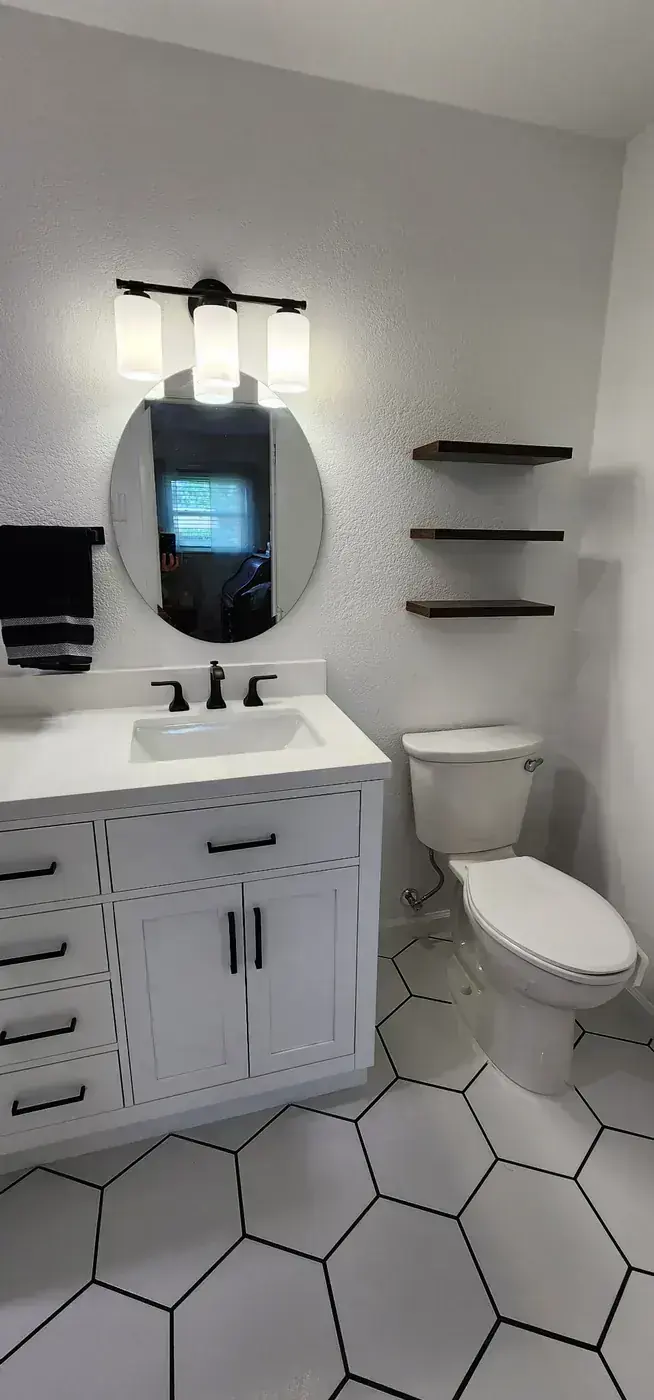 White Vanity and Hex Tile Floor by BNB Concepts