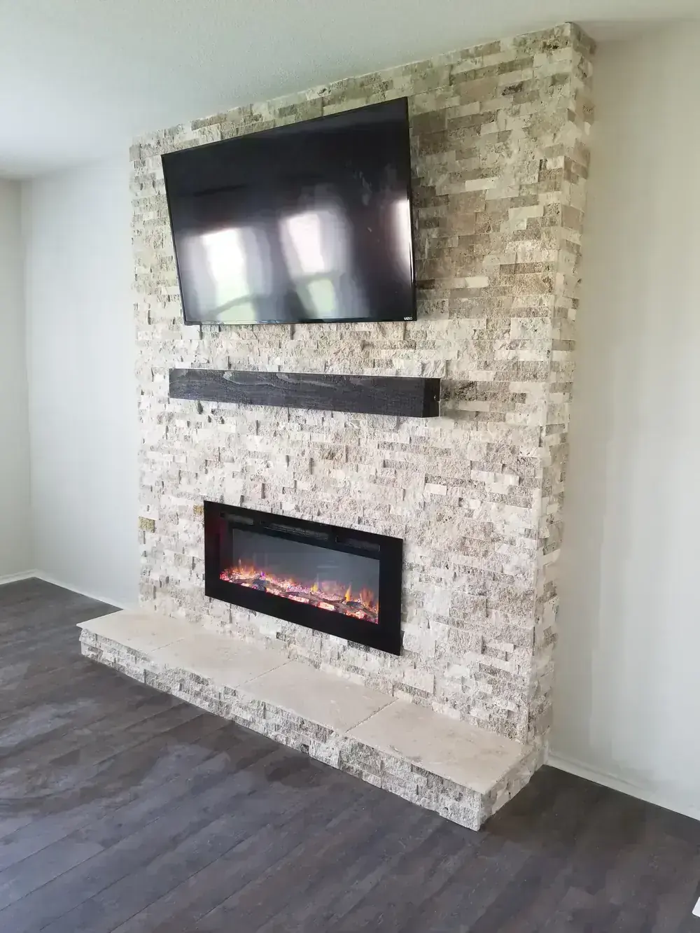 Stacked Stone Fireplace and TV Wall by BNB Concepts